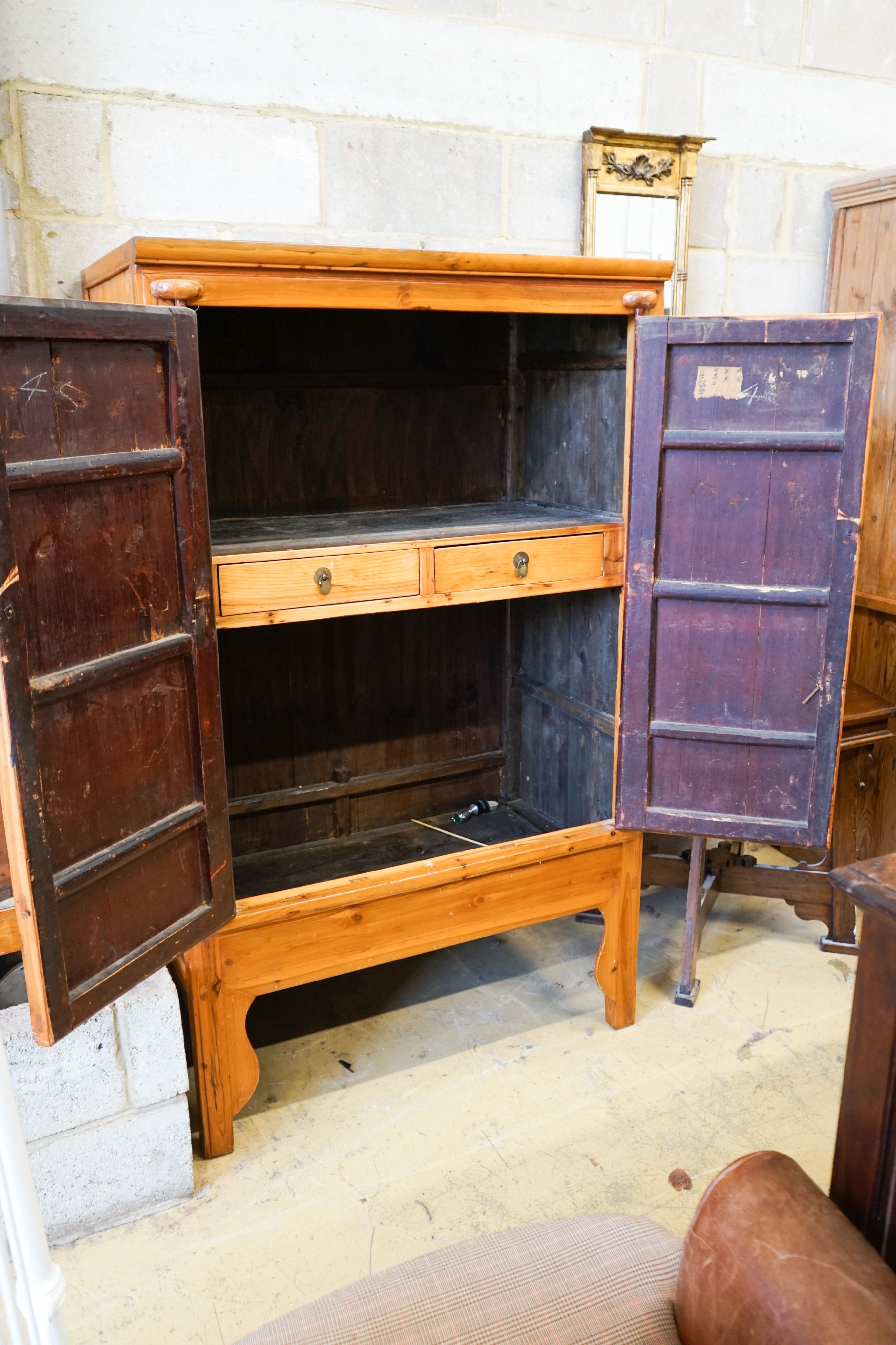 A Chinese pine cabinet, width 104cm, depth 61cm, height 173cm